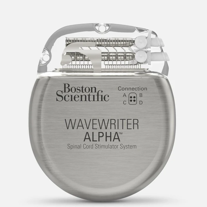 Boston Scientific WaveWriter Alpha generator, a rounded metal implant with a clear connector block on top